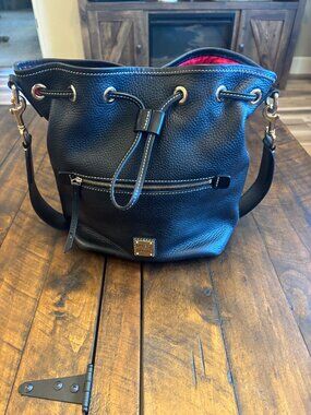 Dooney & Bourke black (rich red inside) pebbled leather Drawstring Bucket Bag